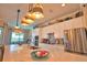 Gorgeous kitchen with a large island, stainless appliances, and bright pendant lighting overhead at 15176 Spanish Point Dr, Port Charlotte, FL 33981