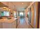 Spacious open kitchen featuring an oversized center island, stainless appliances, and backyard views at 15176 Spanish Point Dr, Port Charlotte, FL 33981