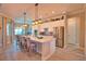 Large, open kitchen with stainless steel appliances, a center island, and bar stool seating at 15176 Spanish Point Dr, Port Charlotte, FL 33981