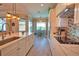 Modern kitchen with a long center island, stainless steel appliances, and stylish countertops at 15176 Spanish Point Dr, Port Charlotte, FL 33981