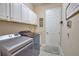 Laundry room features cabinetry, washer and dryer, and access to outside at 15176 Spanish Point Dr, Port Charlotte, FL 33981
