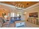 Spacious living room featuring a wood-plank ceiling, tile floors, and open to the entryway at 15176 Spanish Point Dr, Port Charlotte, FL 33981