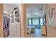 Spacious main bedroom with tray ceilings, a walk-in closet, and serene seating area at 15176 Spanish Point Dr, Port Charlotte, FL 33981