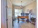Bright home office featuring a modern light fixture and large desk at 15176 Spanish Point Dr, Port Charlotte, FL 33981