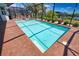 Large pool offers a refreshing escape, surrounded by brick pavers and tropical landscaping for ultimate relaxation and enjoyment at 15176 Spanish Point Dr, Port Charlotte, FL 33981