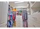 Organized walk-in closet featuring custom shelving, hanging rods, and drawers providing ample storage space at 15176 Spanish Point Dr, Port Charlotte, FL 33981