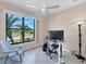 Bright room with a ceiling fan, a large window with a view and a modern workspace setup at 161 Haddock Dr, Rotonda West, FL 33947