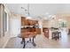 Open dining and kitchen area features granite counters, stainless appliances, and tile flooring at 161 Haddock Dr, Rotonda West, FL 33947