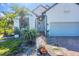 Close up of home featuring landscaped yard and charming rock with the home's address at 161 Haddock Dr, Rotonda West, FL 33947