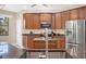 Well-equipped kitchen with granite countertops, stainless steel appliances, and wood cabinetry at 161 Haddock Dr, Rotonda West, FL 33947