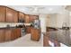 Kitchen featuring granite countertops, stainless steel appliances, and wooden cabinets at 161 Haddock Dr, Rotonda West, FL 33947