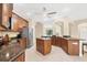 Spacious kitchen features granite countertops, wood cabinets, and stainless steel appliances at 161 Haddock Dr, Rotonda West, FL 33947