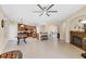 Open-concept living space with arched doorways, fireplace, and tile flooring at 161 Haddock Dr, Rotonda West, FL 33947