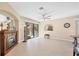 Living room with elegant fireplace, large sliding glass doors, and tile flooring at 161 Haddock Dr, Rotonda West, FL 33947