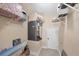 Utility room with shelving, a furnace, and tiled flooring at 161 Haddock Dr, Rotonda West, FL 33947