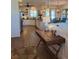 Open-concept kitchen features stainless steel appliances, granite countertops, and seamlessly connects to the living area at 174 Broadmoor Ln, Rotonda West, FL 33947