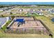 Community playground viewed from above, near homes and a scenic lake at 1836 W Isles Rd, Port Charlotte, FL 33953