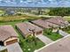 The bird's eye view displays the home's landscaped yard and the proximity to the adjacent properties in the neighborhood at 1836 W Isles Rd, Port Charlotte, FL 33953