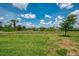 Expansive backyard with lush green lawn and trees, providing ample space for outdoor activities at 1836 W Isles Rd, Port Charlotte, FL 33953