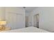 Bright bedroom featuring a closet and access to the neutral tiled bathroom at 1836 W Isles Rd, Port Charlotte, FL 33953