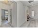 Bright entryway featuring neutral walls, modern light fixtures, tiled floors and stylish console table at 1836 W Isles Rd, Port Charlotte, FL 33953
