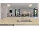Granite kitchen island overlooks the living room at 1836 W Isles Rd, Port Charlotte, FL 33953