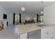 Spacious kitchen island overlooks the living room and dining area at 1836 W Isles Rd, Port Charlotte, FL 33953