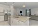Modern kitchen island features granite countertops and stainless steel appliances at 1836 W Isles Rd, Port Charlotte, FL 33953