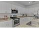 Modern kitchen with granite countertops and stainless steel appliances at 1836 W Isles Rd, Port Charlotte, FL 33953