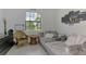 Cozy living room with a comfortable gray sofa, decorative pillows, and natural lighting at 1836 W Isles Rd, Port Charlotte, FL 33953