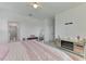 Bedroom features a cozy bed, soft decor, and access to the ensuite bathroom with glass enclosed shower at 1836 W Isles Rd, Port Charlotte, FL 33953