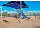 Community playground featuring a slide, climbing structures, and a shaded seating area at 1836 W Isles Rd, Port Charlotte, FL 33953