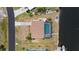 A bird's eye view of a single-Gathering home with a pool, and a boat dock on the water at 18451 Goodman Cir, Port Charlotte, FL 33948