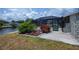 Landscaped backyard with an enclosed pool and convenient access to the canal at 18451 Goodman Cir, Port Charlotte, FL 33948