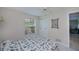 Inviting bedroom with bright, natural light from the window, and closet, for a restful and airy feel at 18451 Goodman Cir, Port Charlotte, FL 33948