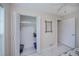 Bright bedroom closet, featuring white shelving and bi-fold doors, providing ample storage space at 18451 Goodman Cir, Port Charlotte, FL 33948