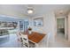 The dining room is sunny and bright and offers views of the pool at 18451 Goodman Cir, Port Charlotte, FL 33948