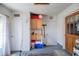Garage featuring cabinets, utility sink, and secondary door. Good space and functionality at 18451 Goodman Cir, Port Charlotte, FL 33948