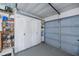 Well-organized garage with ample storage shelves and cabinets for tools and equipment at 18451 Goodman Cir, Port Charlotte, FL 33948