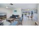 Open-concept living and dining area with tile floors and lots of natural light at 18451 Goodman Cir, Port Charlotte, FL 33948