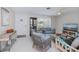 Comfortable living room with tile flooring, cozy furniture, and natural light at 18451 Goodman Cir, Port Charlotte, FL 33948
