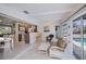 The open living space features kitchen, dining, living room and pool views at 18451 Goodman Cir, Port Charlotte, FL 33948