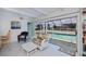 This sunroom offers stunning pool views and plenty of natural light at 18451 Goodman Cir, Port Charlotte, FL 33948