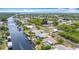 Spacious waterfront community featuring lush landscaping, canal access, private docks, and tranquil neighborhood streets at 18790 Countryman Ave, Port Charlotte, FL 33948