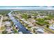 Extensive waterfront community with canal access, boat docks, serene residential streets, and lush natural surroundings at 18790 Countryman Ave, Port Charlotte, FL 33948