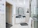 Bathroom featuring a glass shower door and a vanity with decorative vanity lights at 18790 Countryman Ave, Port Charlotte, FL 33948