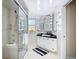 Well-lit bathroom with a glass shower and vanity with Hollywood-style lighting at 18790 Countryman Ave, Port Charlotte, FL 33948