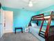 Comfortable bedroom featuring a wooden bunk bed and neutral carpet at 18790 Countryman Ave, Port Charlotte, FL 33948