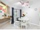 Dining area featuring a white round table, three pendant lights and kitchen counter at 18790 Countryman Ave, Port Charlotte, FL 33948