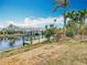 This waterfront property includes a private dock to enjoy water activities at 18790 Countryman Ave, Port Charlotte, FL 33948